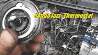 Honda Jazz [ Fit ] Thermostat Location And Replacement 1.4 I-DSI Engine Over Heat Fix